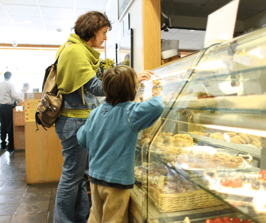 Children Admiring Donuts In The Donut Showcase